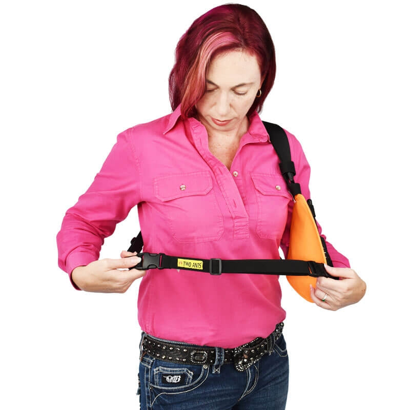 Harness extension strap for wearing radio holsters over heavy winter jackets